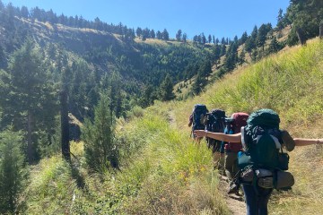 A group of True North Treks backpackers on a hike in Yellowstone