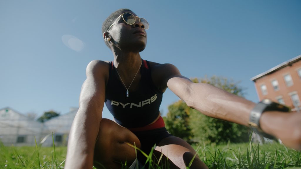 A runner crouches into a stretch