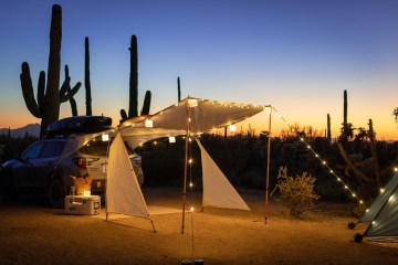 Tent with string lights in the desert.