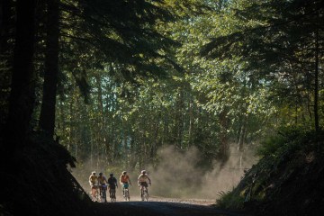 Izzy Sederbaum and friends bike on a trail