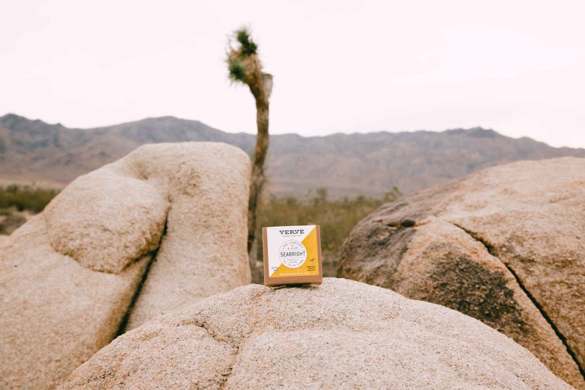 A package of instant coffee on a rocky landscape