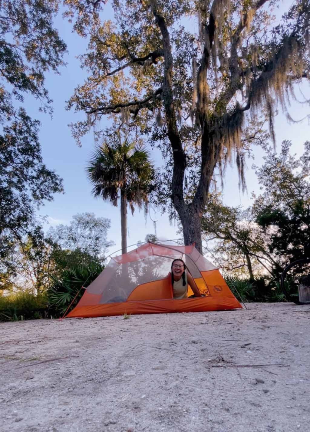 Regina Yan in a tent along her East Coast Greenway journey.