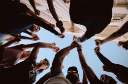 A group of people with their fists raised in the air