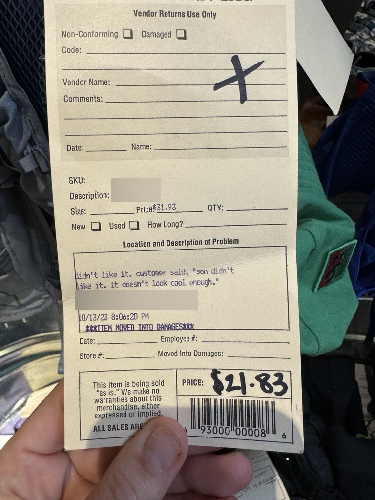 Return tag that reads: "didn't like it. customer said, 'son didn't like it. it doesn't look cool enough.'"