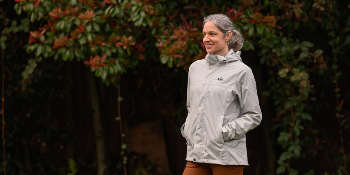 The REI Co-op Rainier rain jacket in Beachstone Gray