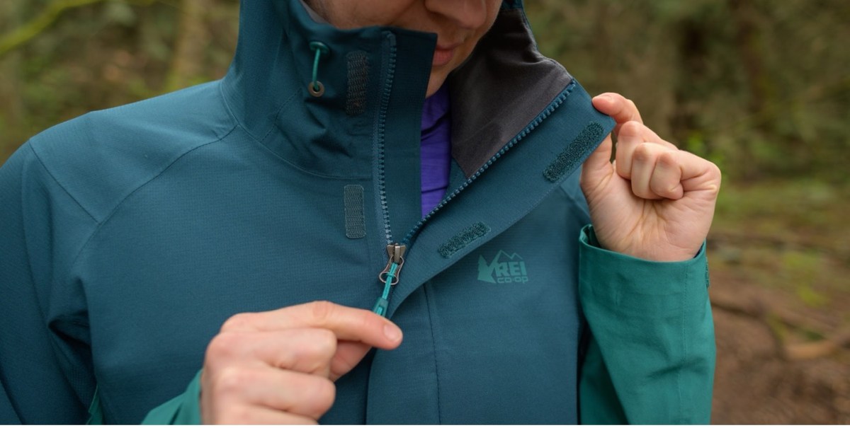 The author unzipping the Flash Stretch rain jacket, to show more detail