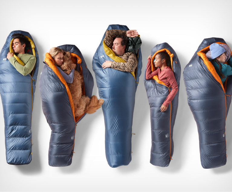 Five campers of diverse sizes and shapes are showing relaxing in five REI Co-op sleeping bags in different sleeping positions.