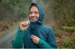 The author in the REI Co-op Flash Stretch rain jacket in Sea Crater/Teal