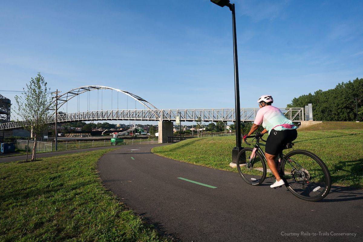 Image of a person on bike on a paved trail in Cleveland.