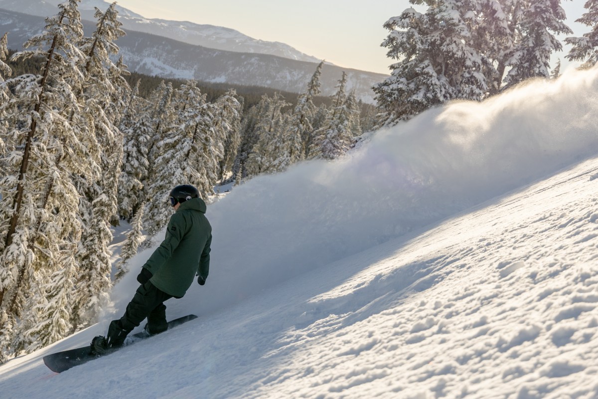 Image of a snowboarder on a snowy slope.
