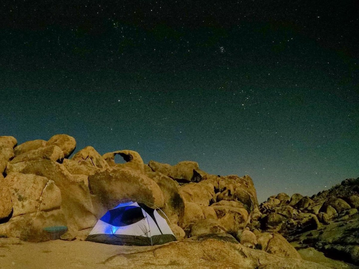 Image of a tent in a desert at night