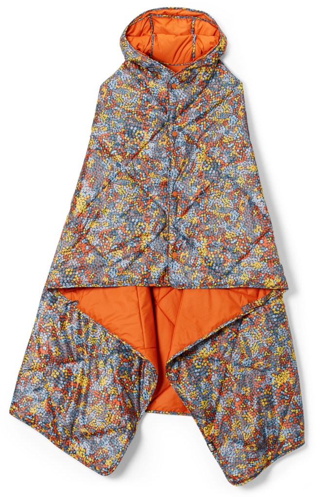 A pattered camp wrap being displayed, hung from its hood.
