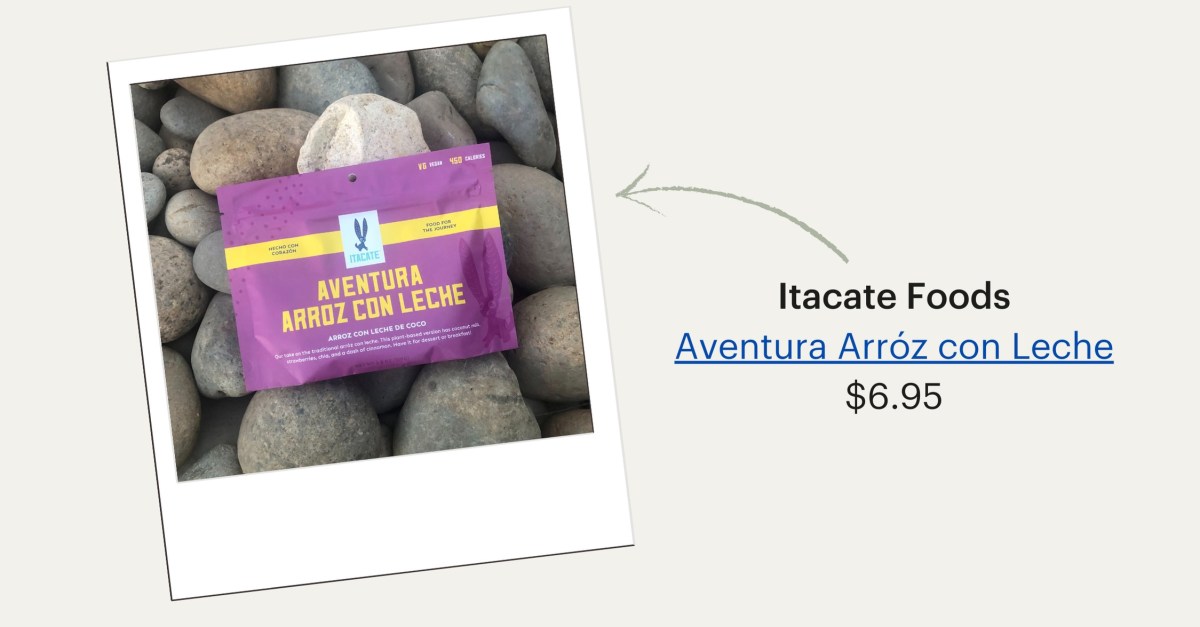 A photo of a purple backpacking food package set on rocks. Itacate Foods Aventura Arroz con Leche, $6.95