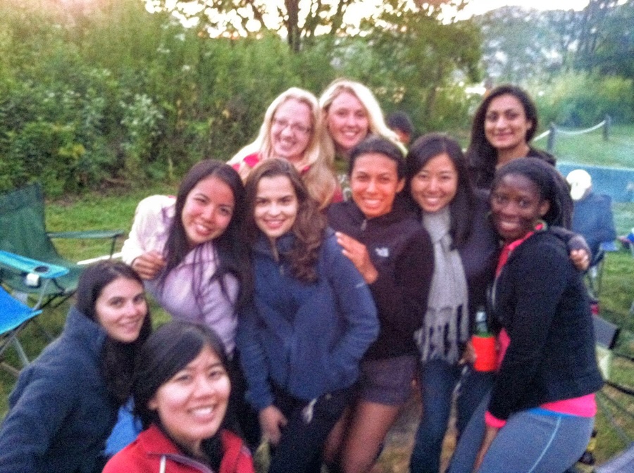 A group of friends in a camping area. Lestarya, founder of Fridie Outdoors, is pictured in the center.