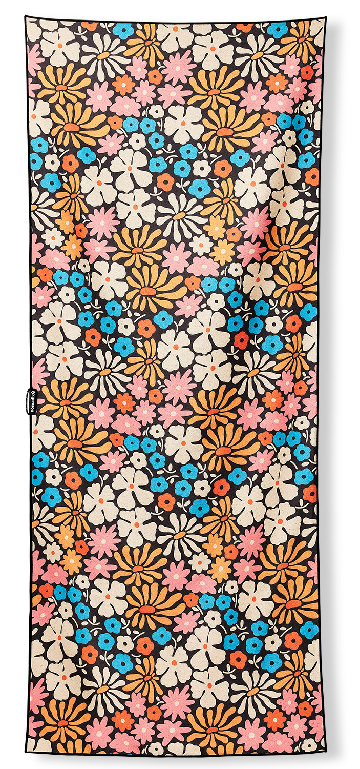 Product shot of a towel with a flower print.