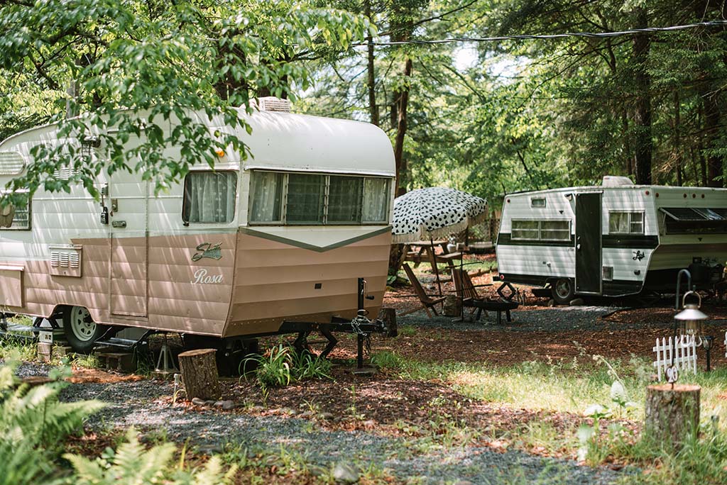 Two renovated RVs nestled in the woods, for glamping