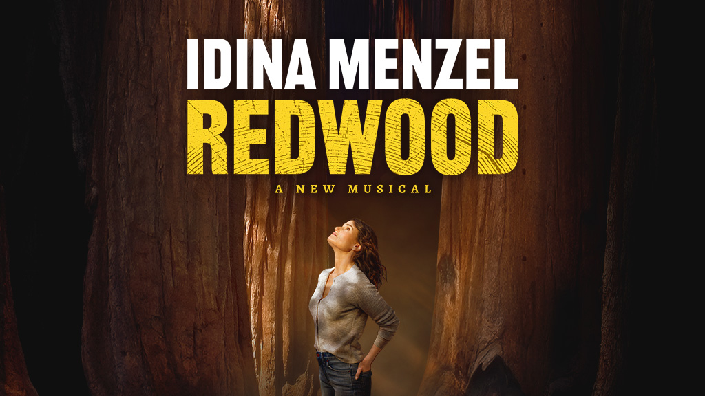 White text that reads Idina Menzel over yellow text that reads Redwood, above a photo of Idina Menzel against a backdrop of tree trunks.