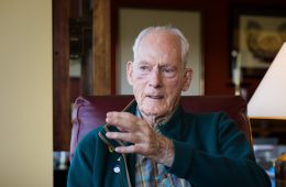 Jim Whittaker gestures as he tells more mountaineering stories in his home.